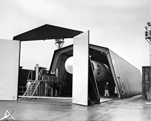 The shed containing a Thor IRBM rolls back on rails