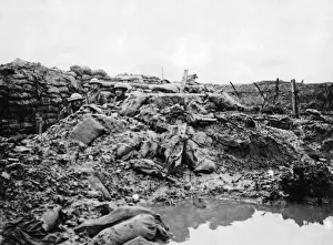 Sandbags Prints: Shell hole caused by German bombing, WW1