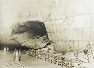 Ship in dry dock with damaged hull