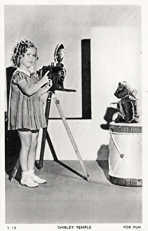 Shirley Temple photographing her teddy bear on a postcard Shirley Temple photographing her teddy bear on a postcard
