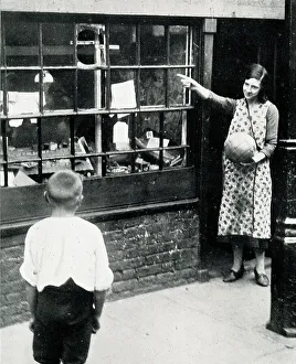Shop window damaged by football