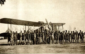 Shulluks pose by Cobham's aeroplane, Malakal, Sudan