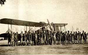 Shulluks pose by Cobhams aeroplane, Malakal, Sudan