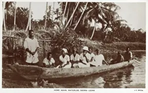 Sierra Leone - Family in a log canoe