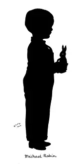 Silhouette of boy with toy rabbit