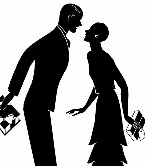 Gifts Collection: Silhouette of couple giving each other Christmas presents
