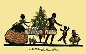 Silhouette. Family celebrate Xmas