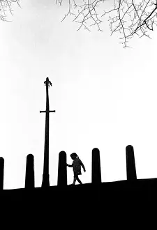 Silhouette of little girl at play, Brinksway, Stockport, Eng