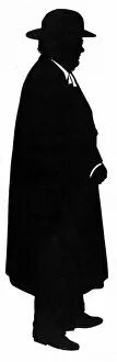 Images Dated 21st February 2012: Silhouette of a man in hat and coat