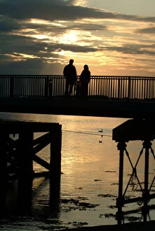 Images Dated 22nd July 2019: Silhouette - man and woman watching the sunset - Caernarfon