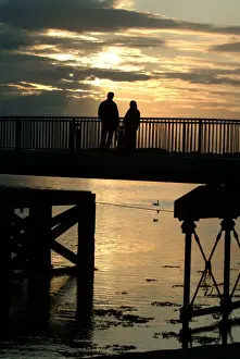 Share Prints: Silhouette - man and woman watching the sunset - Caernarfon