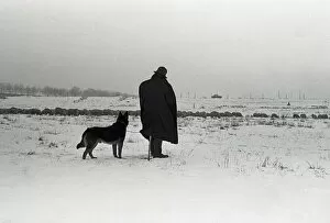 Images Dated 17th February 2011: Silhouetted figure of a man and his dog