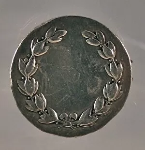 Silver award medal made into a brooch