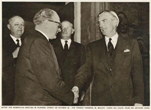 Sir Anthony Eden (right) shakes hands with French Premier Guy Alcide Mollet (1905-1975