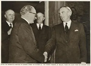 Eden Prints: Sir Anthony Eden (right) shakes hands with French Premier Guy Alcide Mollet (1905-1975
