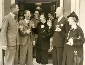 Sir Connop and Lady Guthrie and Mrs Greta Scott raise a toas