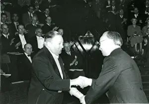 Sir Roy Dobson, CBE, left, is presented with his certifi?