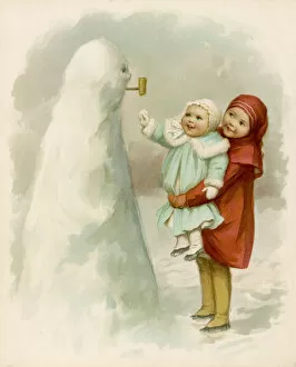 Cold Gallery: Sister holding up baby to see their snowman