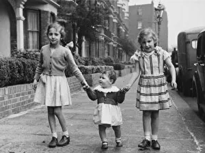 1950s Childhood Gallery: Three sisters walking down the street