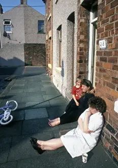 Barrow Prints: Sitting on the pavement outside a house in Barrow in Furness