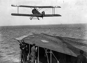 A skid-equipped Sopwith 1 1/2 Strutter takes-off from a ship A skid-equipped Sopwith 1 1/2 Strutter takes-off from a ship