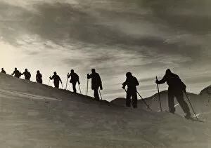 Images Dated 8th August 2017: Skiers Climbing Hill