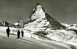 Cervin Prints: Skiers and the Matterhorn (Mont Cervin), Switzerland