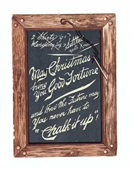 Images Dated 9th December 2015: Slate with pen and comic greeting on a Christmas card