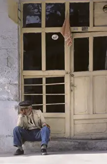 Sleeping old man on doorstep, Turkey