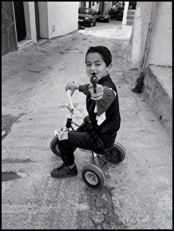 Images Dated 30th August 2016: Small boy pointing a toy gun, Malaga, Spain