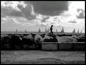 Small boy on seawall Marina di Pisa Italy