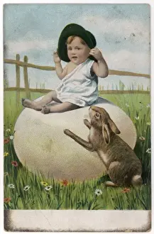 Daisies Prints: Small boy sitting on a large Easter egg