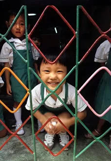 Images Dated 8th August 2019: A small child behind the grill of a kindergarten, Hong Kong