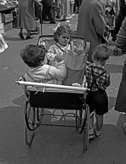 Whitechapel Prints: Small children and pram, Whitechapel Market, London