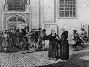 A small crowd has gathered to watch as Martin Luther directs A small crowd has gathered to watch as Martin Luther directs