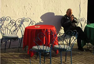 Andalucia Collection: Smoker outside cafe, Mijas, Spain