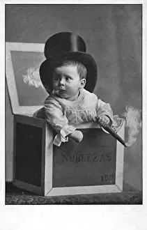 Bizarre Prints: Smoking Baby in a cigar box wearing a silk top hat