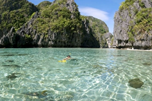 Images Dated 20th January 2008: A snorkeller swims into an entry of a Big Lagoon