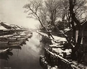 Snow scene with boats, canal in Tokyo, Japan