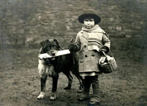 Brings Collection: Social History - Dog brings home newspaper with young child