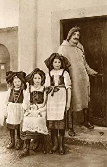 Soldier with three girls, Alsace, France