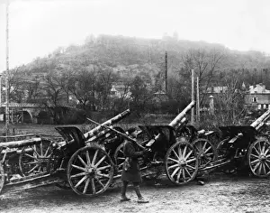 Soldier guarding captured guns, Montmedy, France