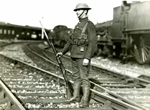 Guarding Collection: Soldier guarding line at Slough during railway strike