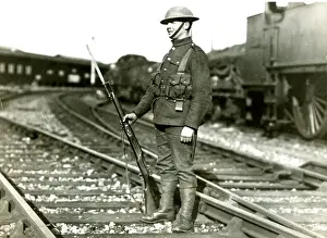 Guarding Prints: Soldier guarding line at Slough during railway strike