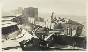 Soldier inspecting destroyed train, Iraq