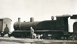 Soldier inspecting sabotaged train, Iraq
