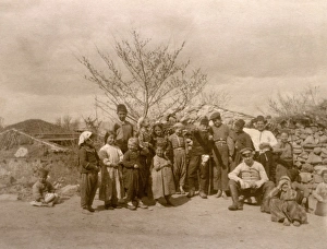 Amid Gallery: Soldier sitting amid a group of children - Sarajevo, Bosnia