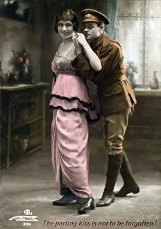 Images Dated 10th January 2013: Soldier standing behind a young lady - Postcard