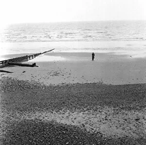 Breaker Gallery: Solitary man on the beach at Eastbourne, Sussex