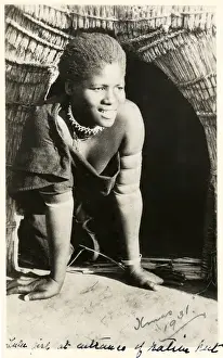 Bangles Prints: South Africa - smiling Zulu girl kneeling in her doorway